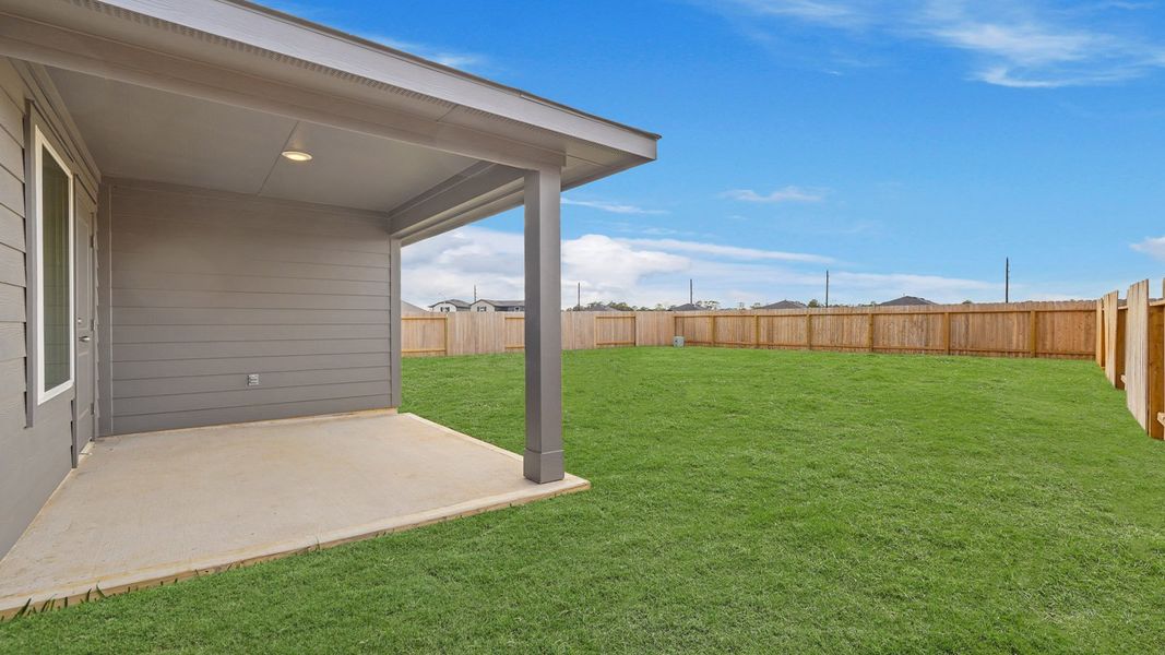 Exterior details and patio area of a home in Grand Pines, Magnolia (Image 3).