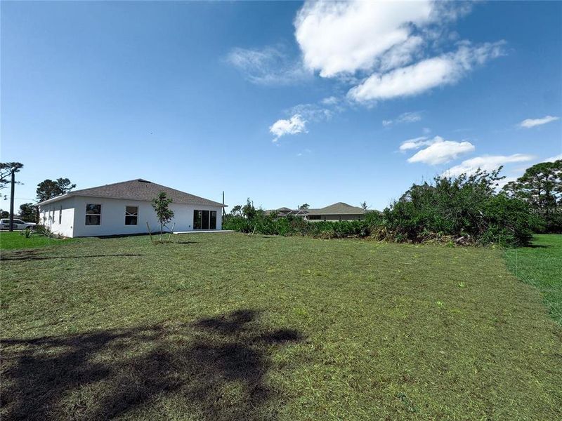 Front exterior of a new home in , Rotonda West, FL, highlighting curb appeal (Image 2).