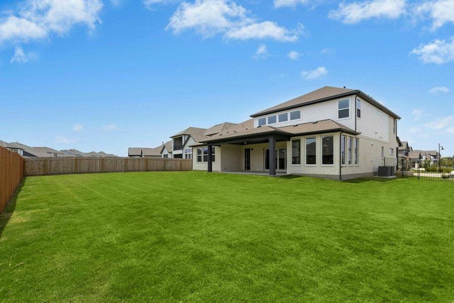 Front exterior of a new home in Santa Rita Ranch, Liberty Hill, TX, highlighting curb appeal (Image 16).