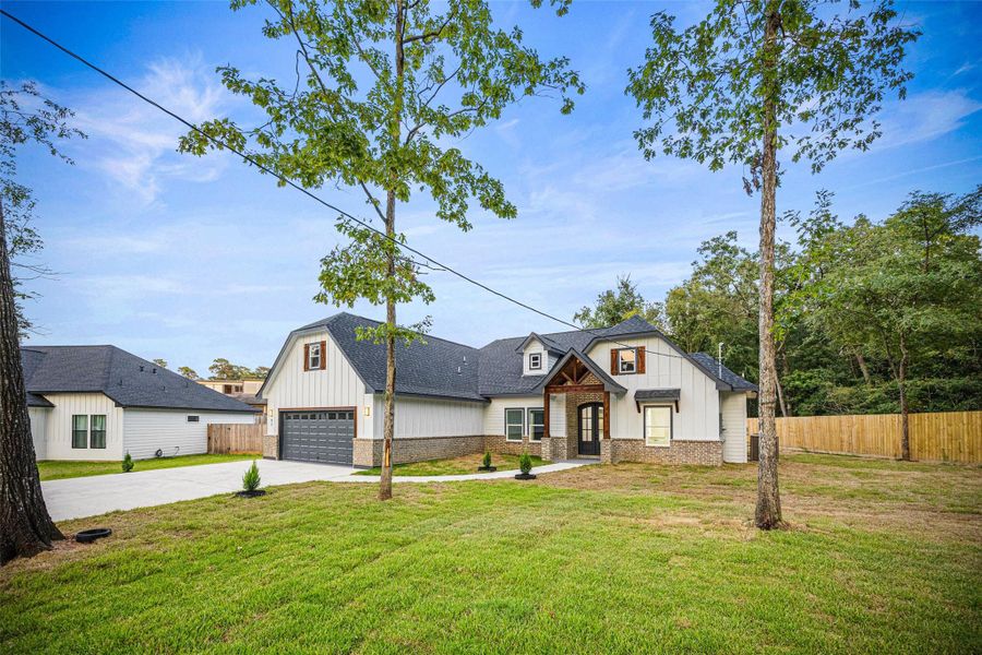 Front exterior of a new home in , Conroe, TX, highlighting curb appeal (Image 15).