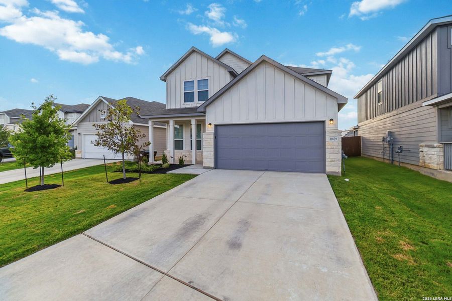 Front exterior of a new home in Davis Ranch, Helotes, TX, highlighting curb appeal (Image 24). Front exterior of a new home in Davis Ranch, Helotes, TX, highlighting curb appeal (Image 24).