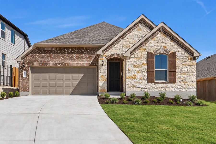Front exterior of a new home in West Cypress Hills, Spicewood, TX, highlighting curb appeal (Image 20). Front exterior of a new home in West Cypress Hills, Spicewood, TX, highlighting curb appeal (Image 20).