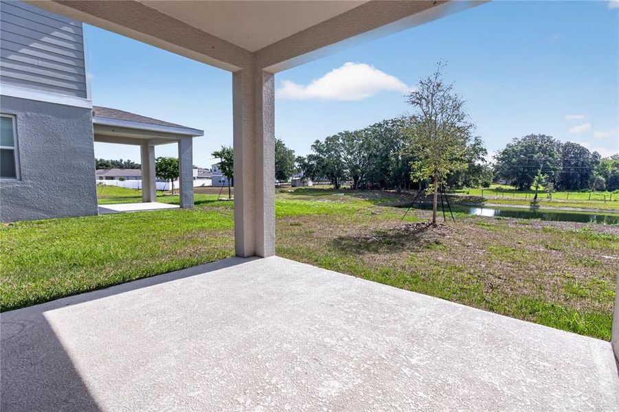 Exterior details and patio area of a home in Seasons at Forest Creek, Haines City (Image 44).
