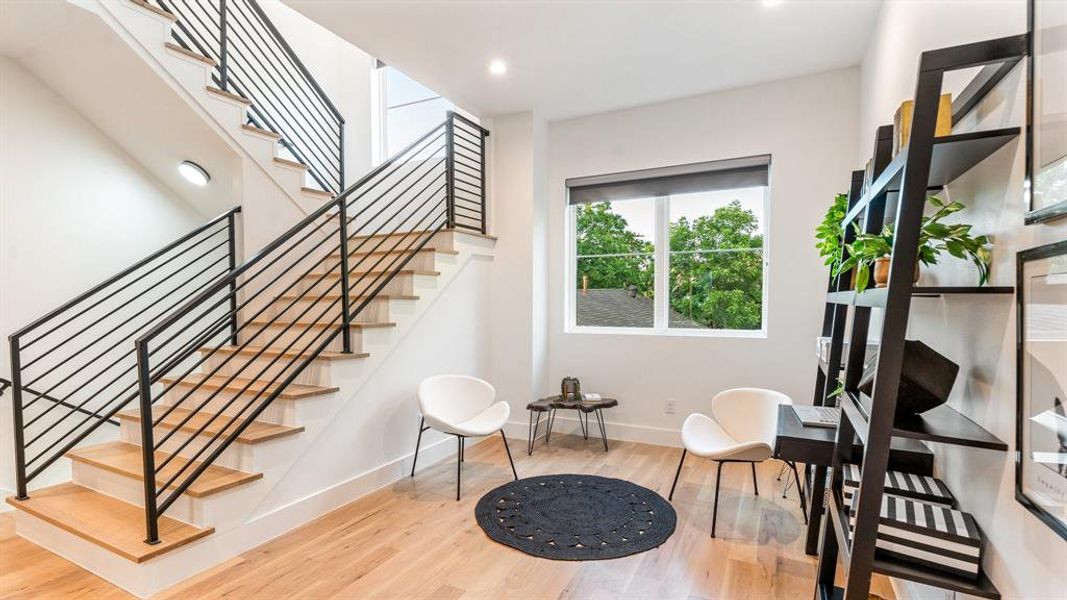 Living area with light hardwood / wood-style floors