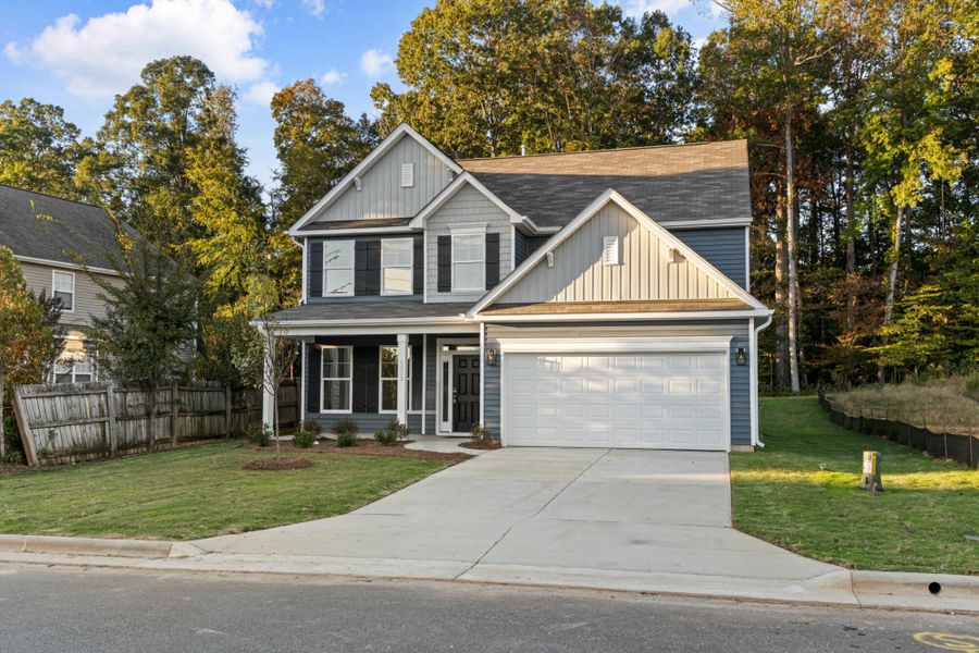 Front exterior of a new home in Chandler Ridge, McLeansville, NC, highlighting curb appeal (Image 20).