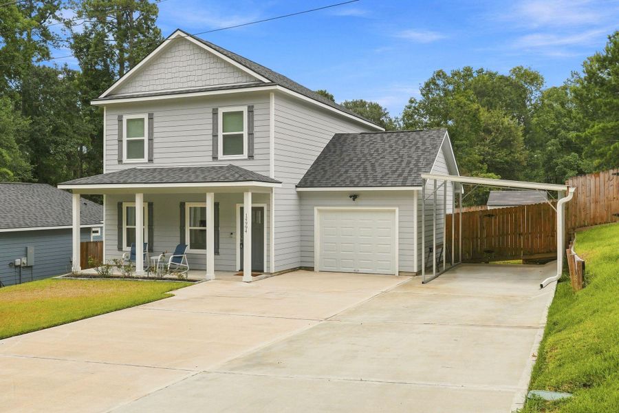 Front exterior of a new home in Arrowhead Lakes, Willis, TX, highlighting curb appeal (Image 18).
