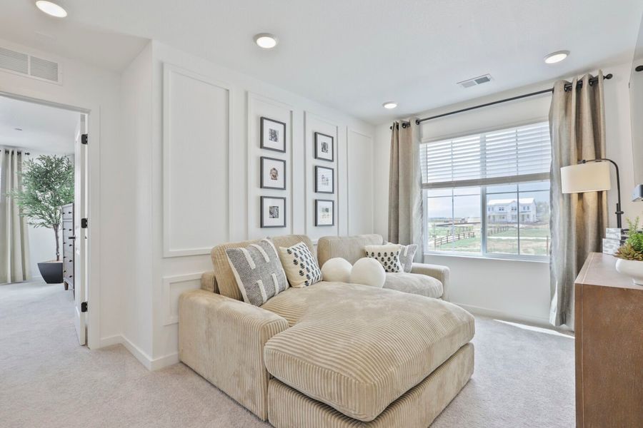 Representative furnished interior of a home built from the Novella Four by Brookfield Residential in Barefoot, Firestone (Image 9).