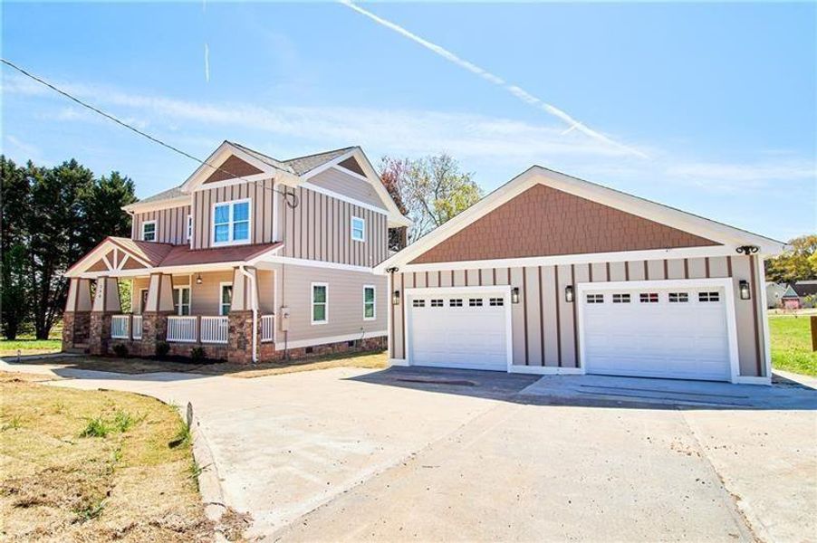 Front exterior of a new home in , Riverdale, GA, highlighting curb appeal (Image 12). Front exterior of a new home in , Riverdale, GA, highlighting curb appeal (Image 12).