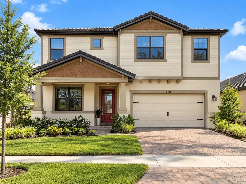 Representative exterior photo of a completed home built from the 50' - Sandalwood by William Ryan Homes in Tamarack at Two Rivers, Zephyrhills, FL (Image 22).