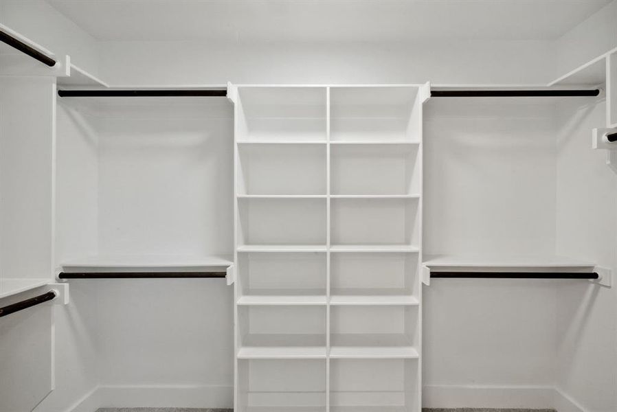 Spacious closet featuring carpet flooring