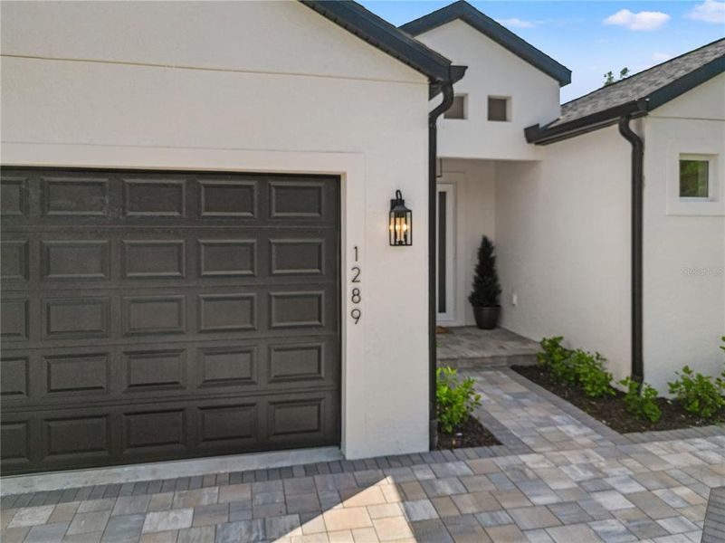 Front exterior of a new home in , North Port, FL, highlighting curb appeal (Image 1). Front exterior of a new home in , North Port, FL, highlighting curb appeal (Image 1).