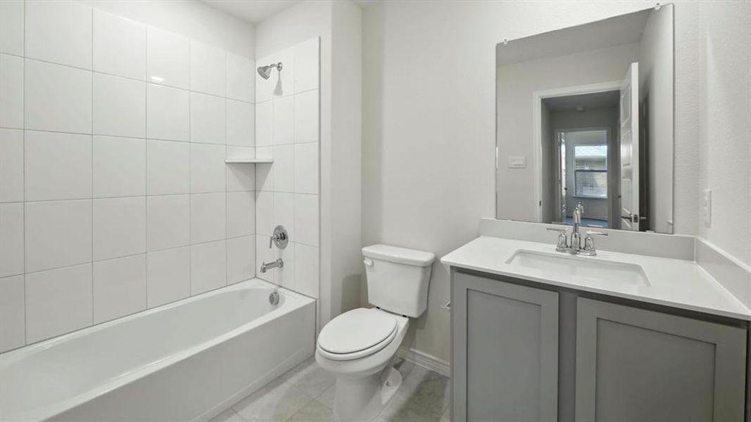 Bathroom with shower / bath combination and vanity