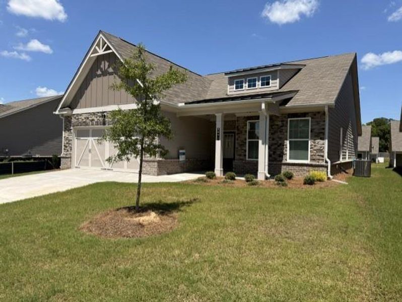 Front exterior of a new home in Cooper's Walk, Loganville, GA, highlighting curb appeal (Image 20). Front exterior of a new home in Cooper's Walk, Loganville, GA, highlighting curb appeal (Image 20).