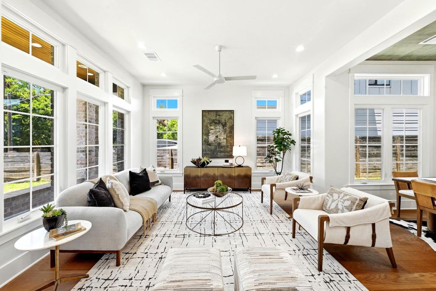 A well-lit living area showcases rich hardwood floors and an inviting atmosphere. A well-lit living area showcases rich hardwood floors and an inviting atmosphere.