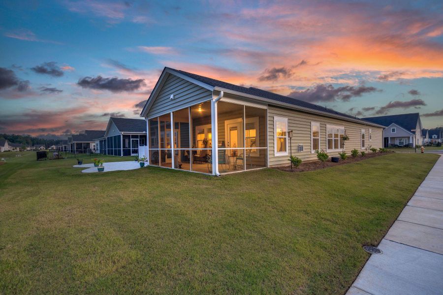 Front exterior of a new home in Horizons at Summers Corner | 55+: The Legends, Summerville, SC, highlighting curb appeal (Image 23).