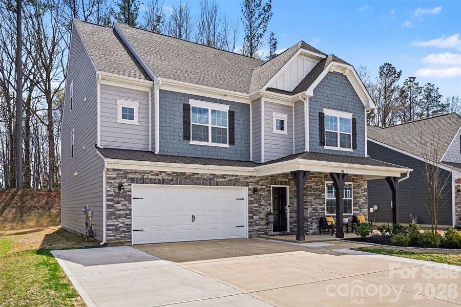 Front exterior of a new home in Falls Cove at Lake Norman, Troutman, NC, highlighting curb appeal (Image 24).