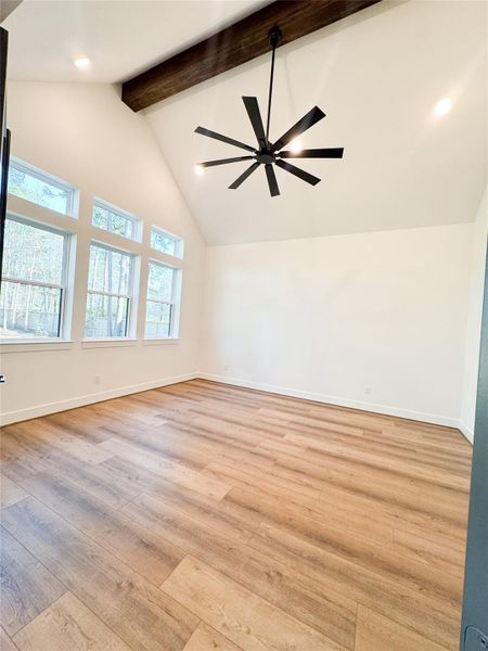 Bright Gameroom with Cathedral Ceiling and Wood Beam