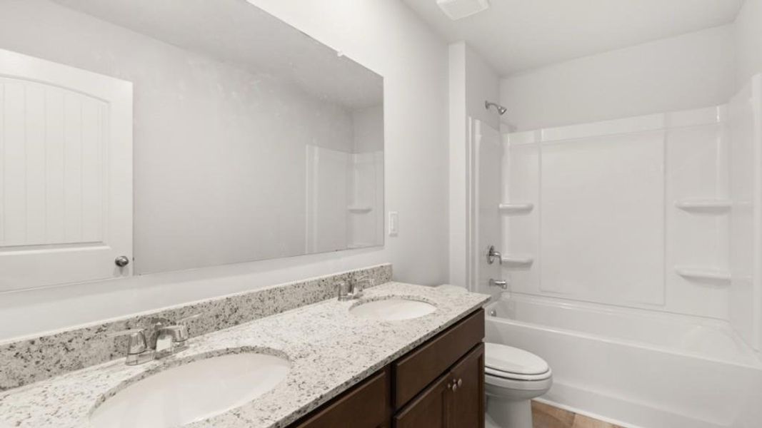 Furnished interior view inside a new home in Northwoods at Mirror Lake, Villa Rica (Image 10).