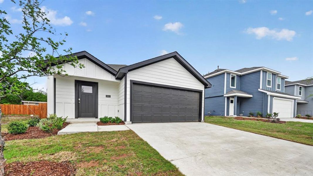 Contemporary single-story residence featuring a white horizontal siding exterior with black trim accents
