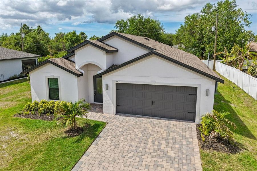 Front exterior of a new home in , Port Charlotte, FL, highlighting curb appeal (Image 20).