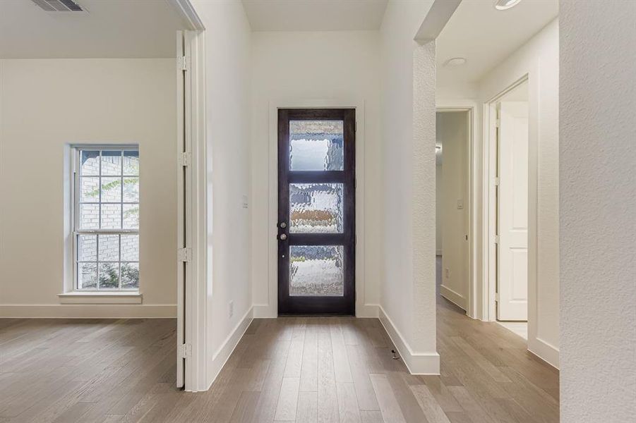 Foyer entrance featuring light wood-type flooring Foyer entrance featuring light wood-type flooring