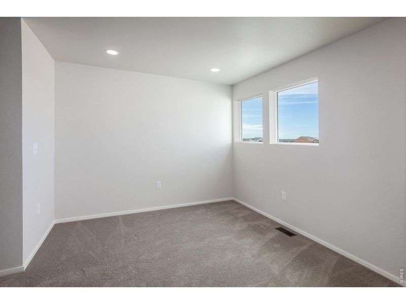 Spacious, unfurnished interior of a new home in Prairie Song Story Collection - Single Family Homes, Windsor (Image 24).