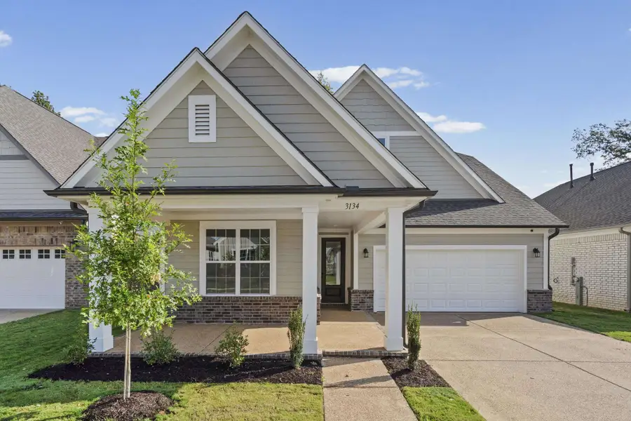 Light gray horizontal siding with dark gray shingle roofing, white trim, and a prominent front gable Light gray horizontal siding with dark gray shingle roofing, white trim, and a prominent front gable