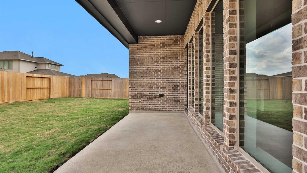 Exterior details and patio area of a home in Candela South 50', Richmond (Image 3).