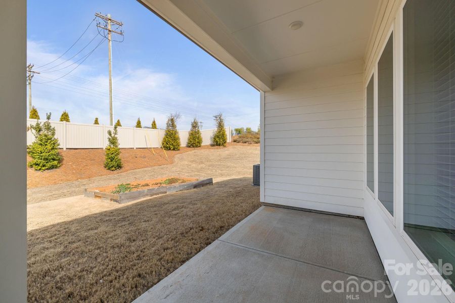 Exterior details and patio area of a home in Encore at Streamside - Classic Series, Waxhaw (Image 21).