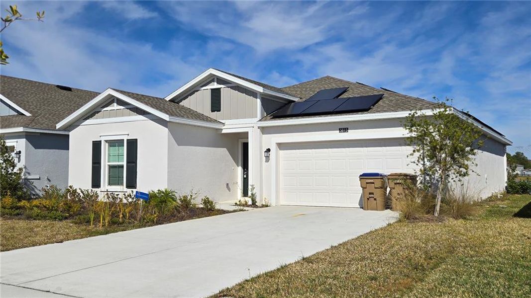 Front exterior of a new home in , Kissimmee, FL, highlighting curb appeal (Image 20).