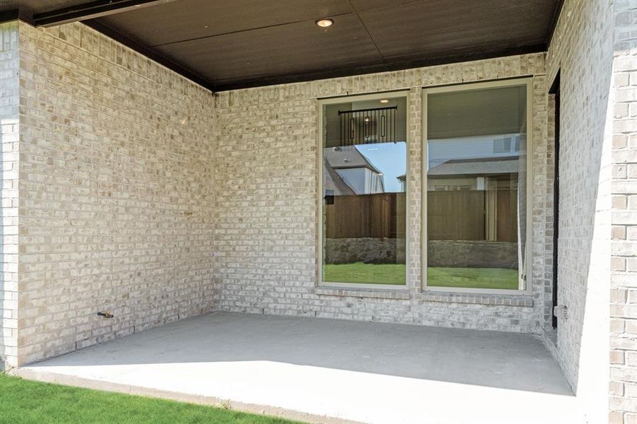 Exterior details and patio area of a home in Windsong Ranch Classic 61, Prosper (Image 27). Exterior details and patio area of a home in Windsong Ranch Classic 61, Prosper (Image 27).