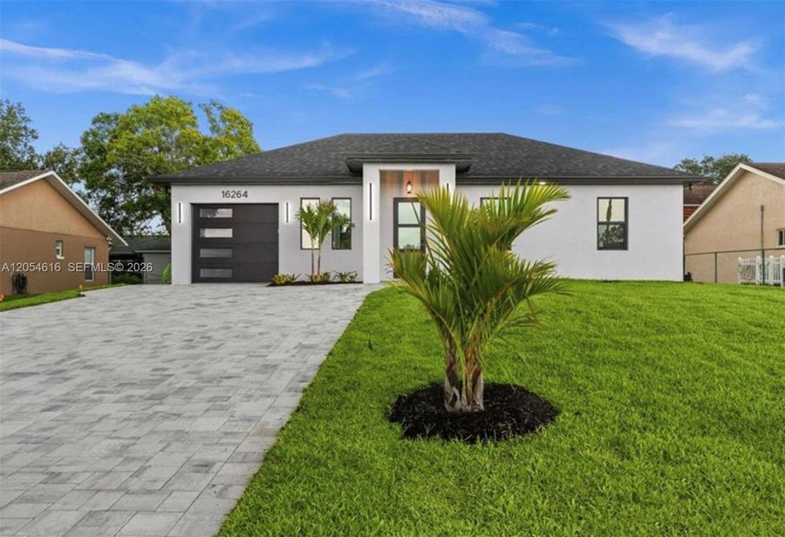 Front exterior of a new home in , North Fort Myers, FL, highlighting curb appeal (Image 2). Front exterior of a new home in , North Fort Myers, FL, highlighting curb appeal (Image 2).