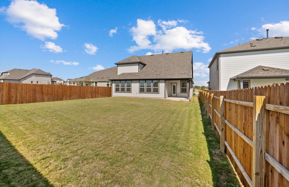 Exterior details and patio area of a home in Saddleback at Santa Rita Ranch, Liberty Hill (Image 4). Exterior details and patio area of a home in Saddleback at Santa Rita Ranch, Liberty Hill (Image 4).