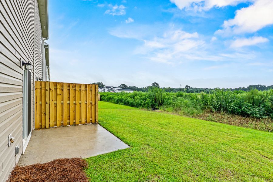 Representative exterior photo of a completed home built from the Balsa by McGuinn Homes in Sibley Village Townhomes, Sumter, SC (Image 35).