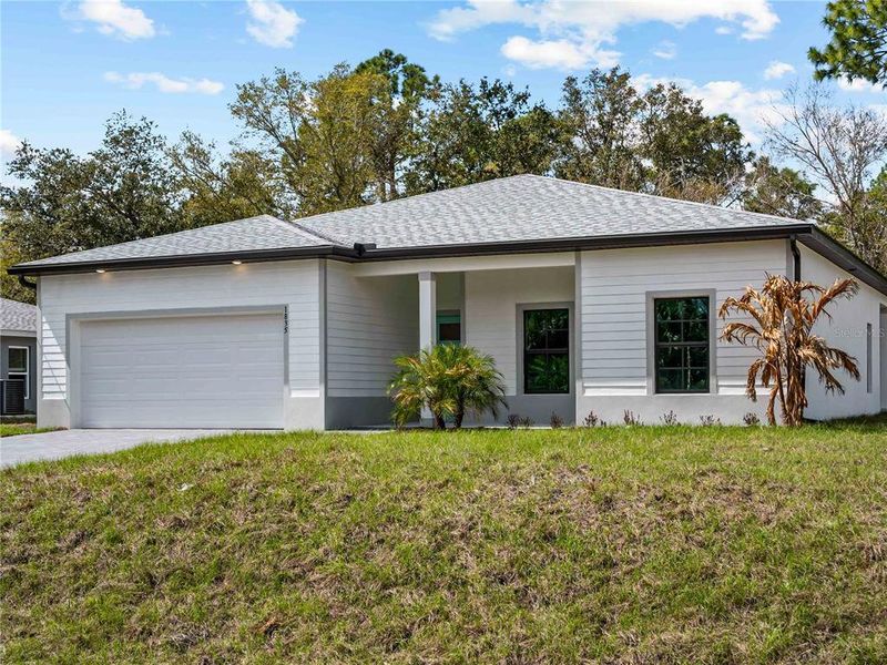 Front exterior of a new home in , North Port, FL, highlighting curb appeal (Image 26).