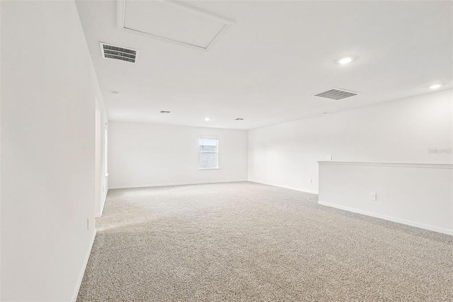 Spacious, unfurnished interior of a new home in The Grove at Stuart Crossing - Signature Series, Bartow (Image 33).