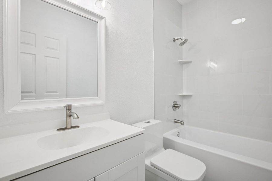 Full bathroom featuring vanity and shower / tub combination