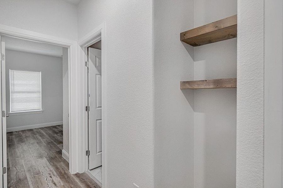 Hallway featuring hardwood / wood-style floors