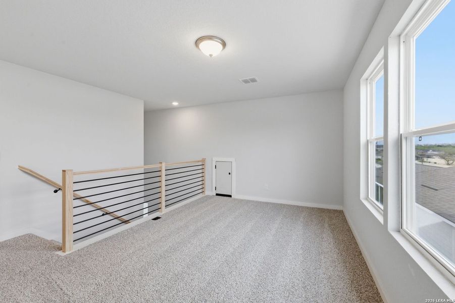 Spacious, unfurnished interior of a new home in The Meadows at Hunters Ranch, San Antonio (Image 30).