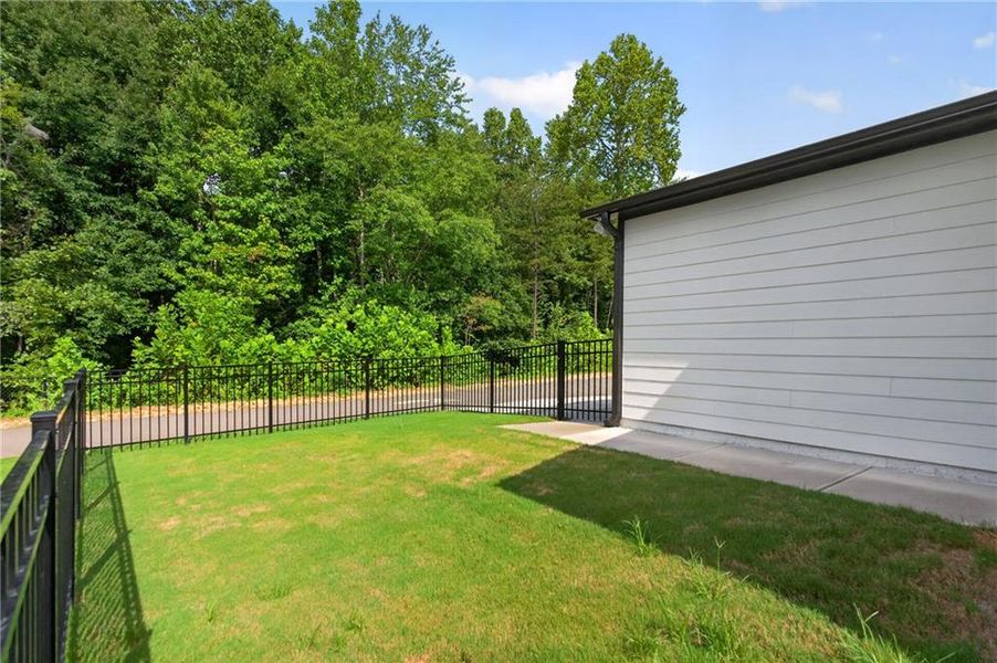 Exterior details and patio area of a home in Marble Tree, Ball Ground (Image 25).