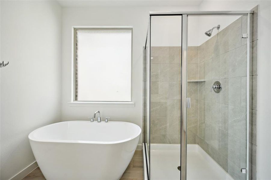 Bathroom featuring separate shower and tub