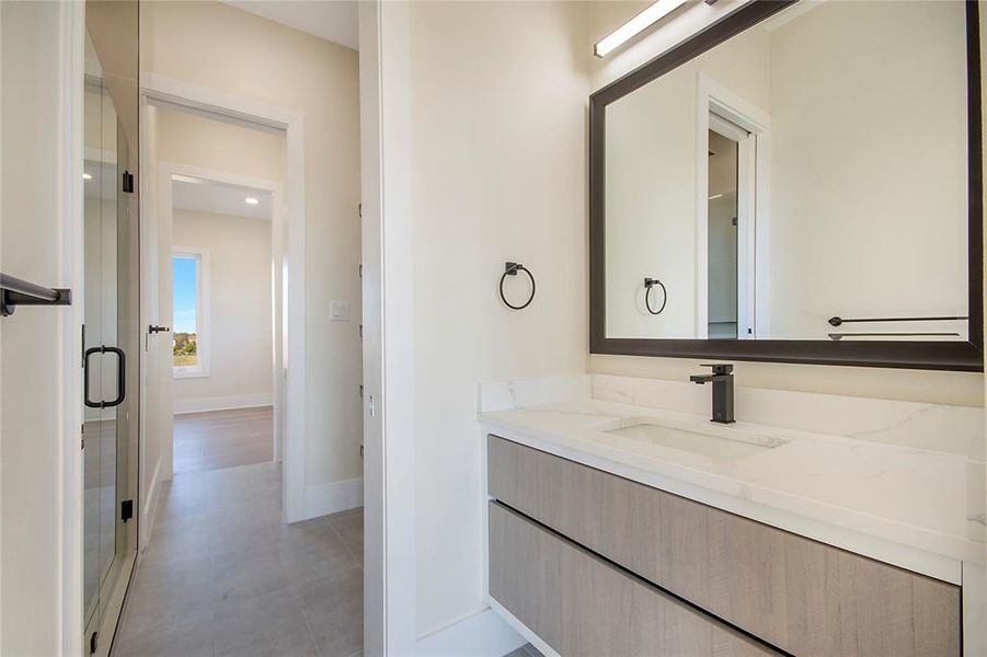 Full bathroom with vanity and a shower stall Full bathroom with vanity and a shower stall