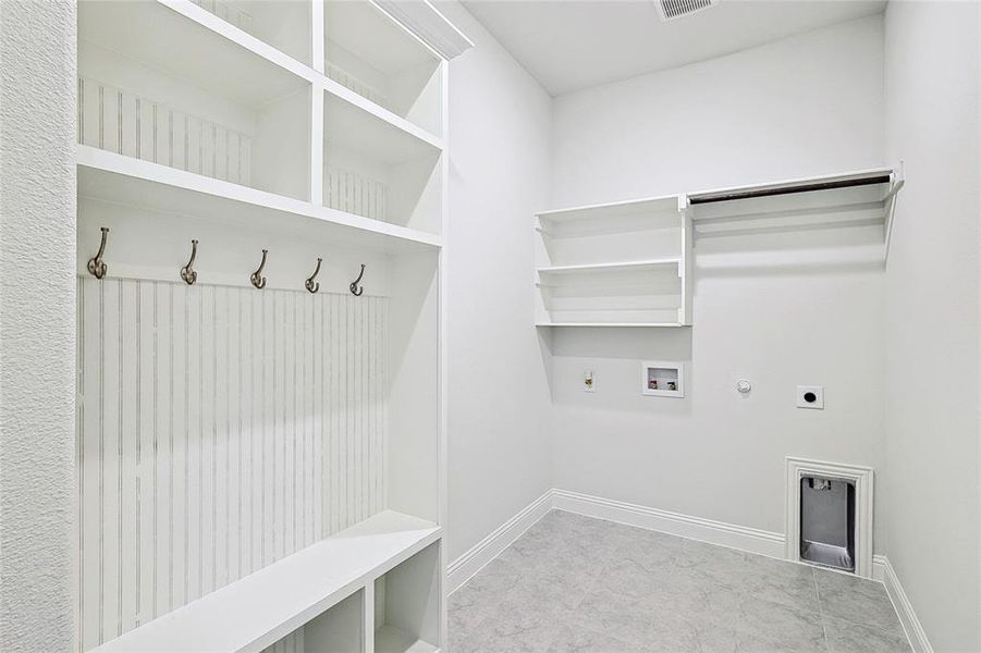 Clothes washing area featuring hookup for a gas dryer, electric dryer hookup, and washer hookup