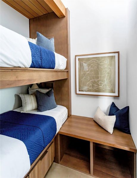 Built-in bunk room with custom woodwork creates a stylish and functional retreat for guests or additional sleeping space. Built-in bunk room with custom woodwork creates a stylish and functional retreat for guests or additional sleeping space.