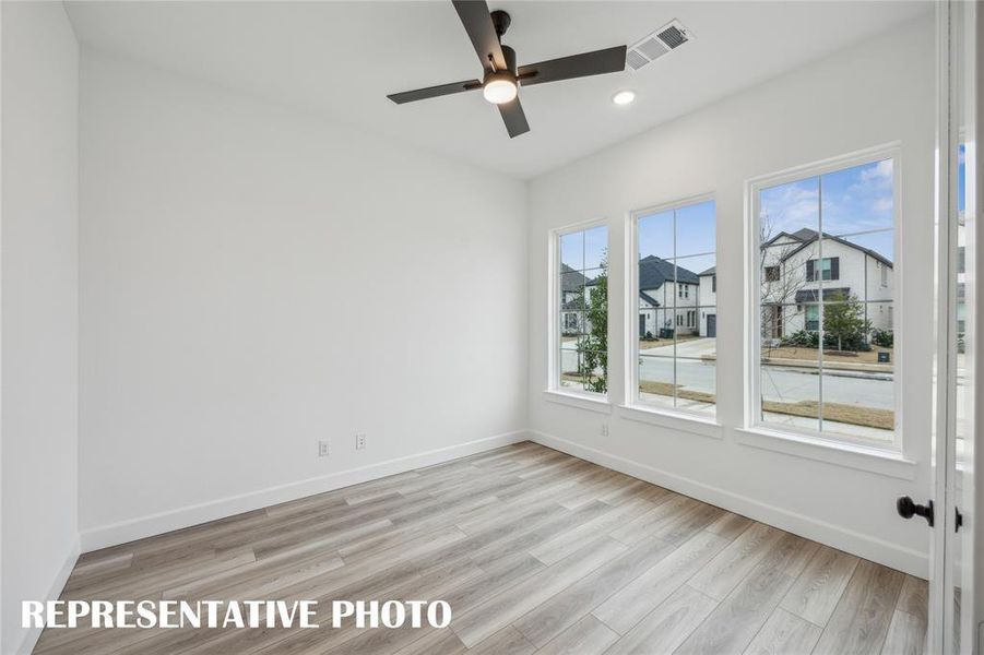 The professional working from home will appreciate this private, light filled home office.  REPRESENTATIVE PHOTO