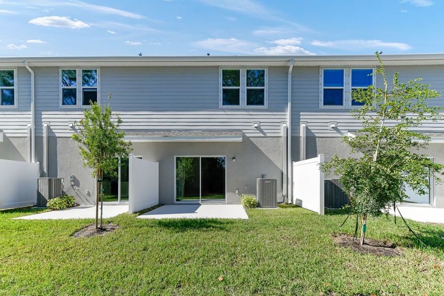 Exterior details and patio area of a home in Vinterra Townhomes, Nokomis (Image 2).