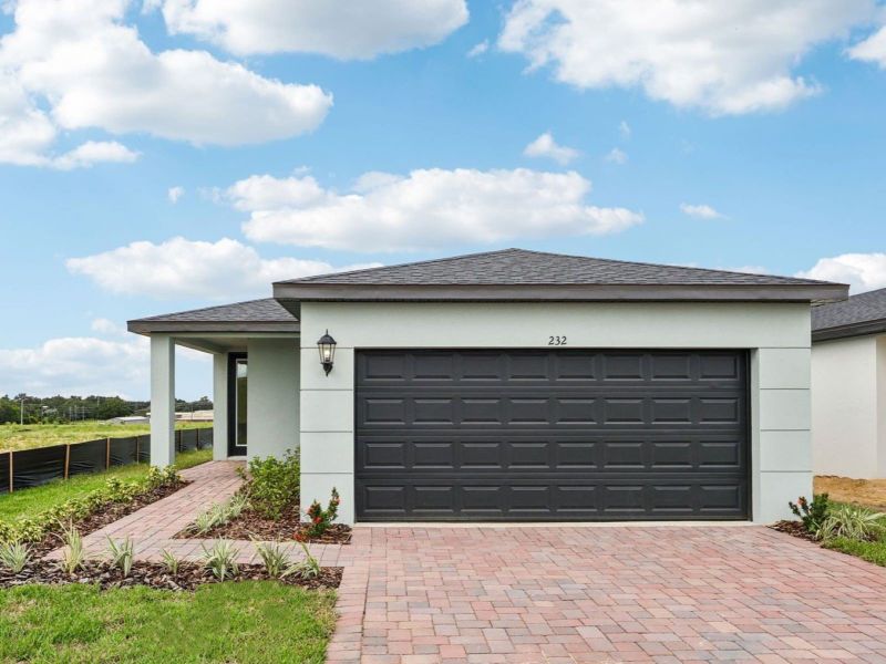 Front exterior of a new home in Hamilton Bluff - Classic Series, Lake Hamilton, FL, highlighting curb appeal (Image 1).