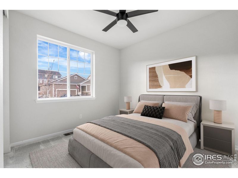 Main Level Bedroom 1, 12'5 x 10'4. is photo has been virtually staged to provide visual ideas for how furniture can be arranged in this area of the home.