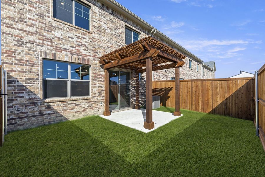 Exterior details and patio area of a home in Wildridge, Oak Point (Image 25).
