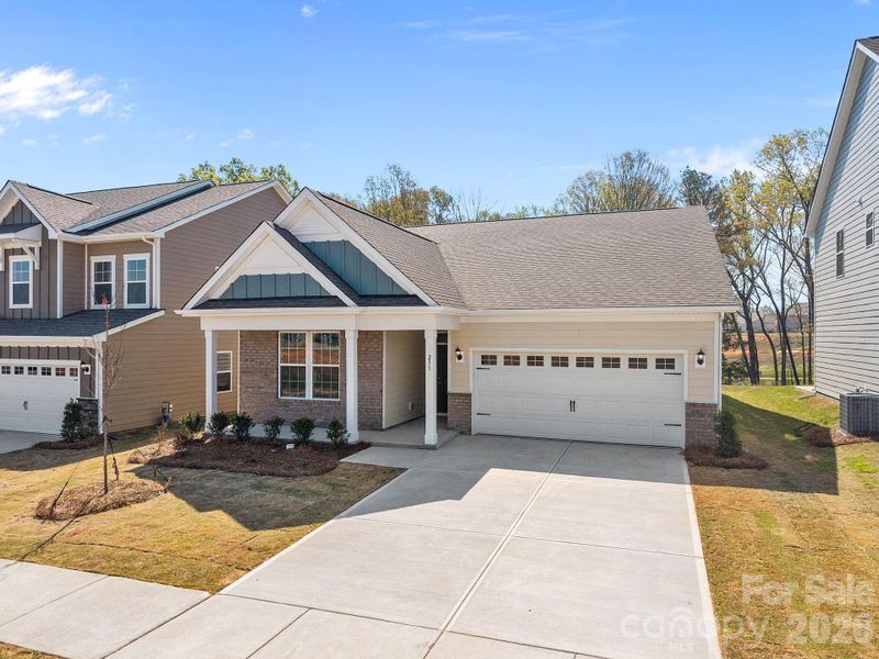 Front exterior of a new home in McFarland Estates, York, SC, highlighting curb appeal (Image 1). Front exterior of a new home in McFarland Estates, York, SC, highlighting curb appeal (Image 1).